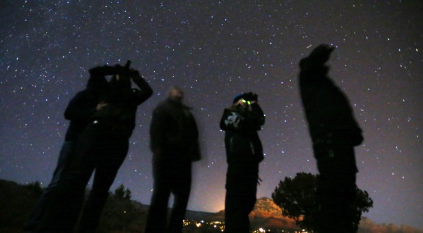 Alien hunters scan the sky during a UFO tour.