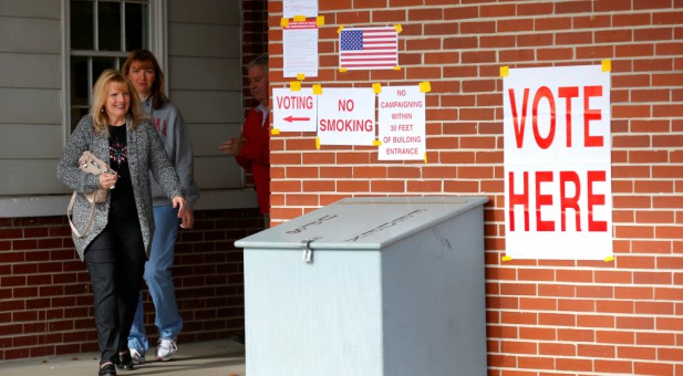 People leave a polling station in Gallant, Alabama.
