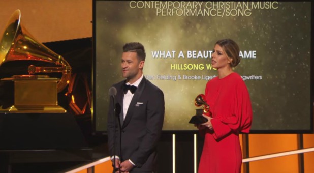 Ben Fielding and Brooke Lightfield accept their award at the Grammy Awards.