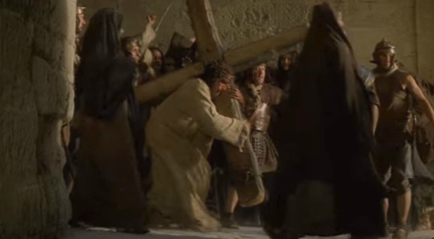 Jim Caviezel carries the cross in 'Passion of The Christ.'