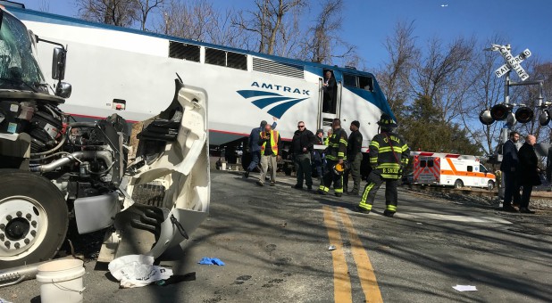 Emergency first responders work at the scene of the crash where an Amtrak passenger train carrying Republican members of the U.S. Congress from Washington to a retreat in West Virginia collided with a garbage truck in Crozet, Virginia.