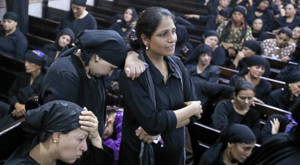Mourners react at the Sacred Family Church for the funeral of Coptic Christians who were killed in Minya, Egypt, May 26, 2017.