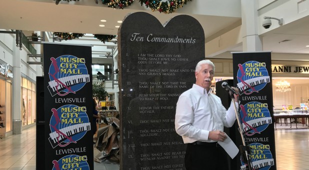 Music City Mall Lewisville general manager Richard Morton unveils a stone tablet that displays the Ten Commandments on Dec. 29, 2017, in Lewisville, Texas.