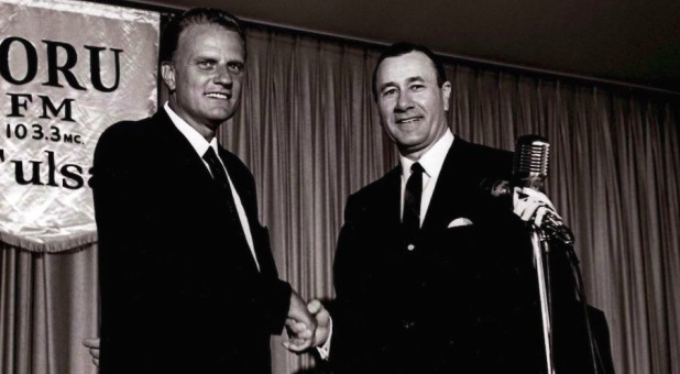 Billy Graham shakes hands with Oral Roberts.