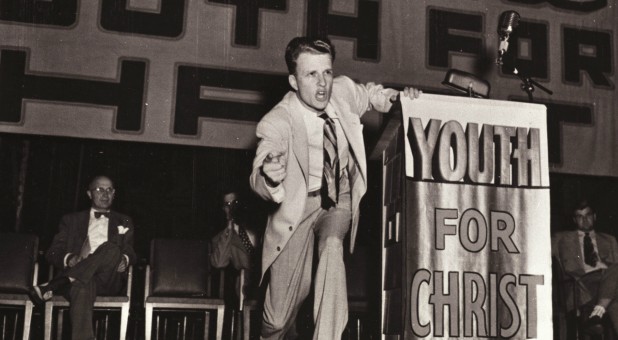 Rev. Billy Graham preaches in his Youth for Christ organization in 1945 in this photo released on Feb. 21, 2018.