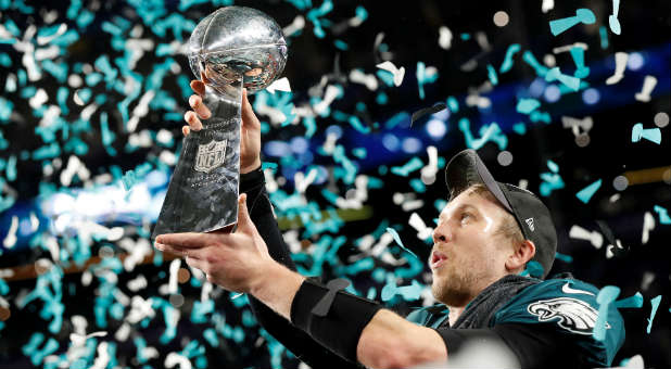 Philadelphia Eagles' Nick Foles celebrates with the Vince Lombardi Trophy after winning Super Bowl LII.