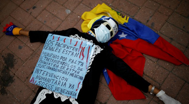 A woman wearing a skeleton costume takes part in a protest against medicinal shortages in Caracas, Venezuela.