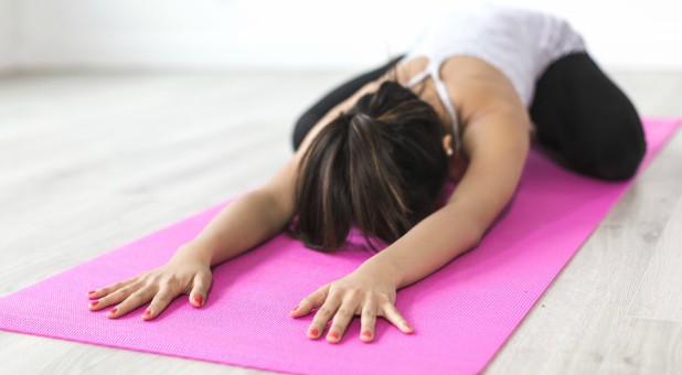A woman practices yoga.