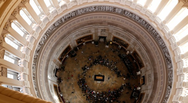 Members of the public visit the late U.S. evangelist Billy Graham as he lies in honor in the Rotunda of the U.S. Capitol.