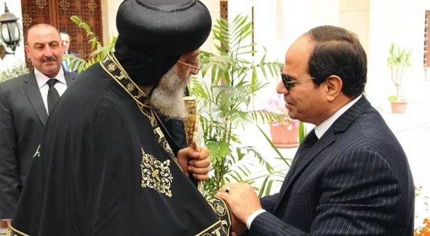 Egyptian President Abdel-Fattah el-Sissi, right, shakes hands with Pope Tawadros II, the 118th pope of the Coptic Orthodox Church of Alexandria and patriarch of the See of St. Mark Cathedral, to offer condolences for the victims of the terrorist incidents of the Palm Sunday bombings in Tanta and Alexandria, in the Abassiya Cathedral in Cairo, on April 13, 2017.