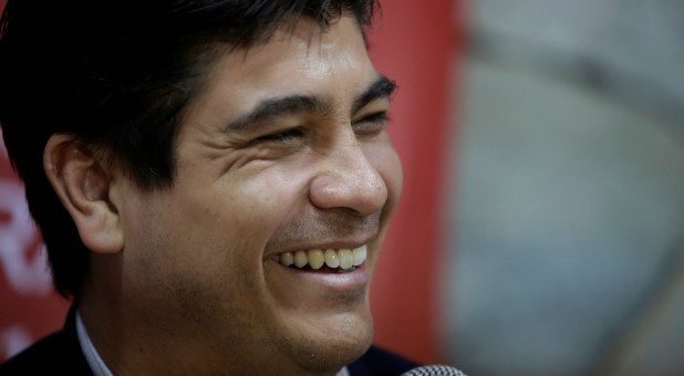 Carlos Alvarado, presidential candidate of the ruling Citizens' Action Party (PAC), smiles as he addresses the media in San Jose, Costa Rica.