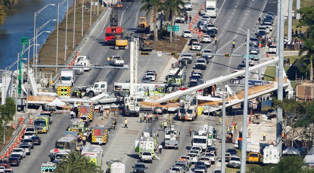 Aerial view shows a pedestrian bridge collapsed at Florida International University in Miami.