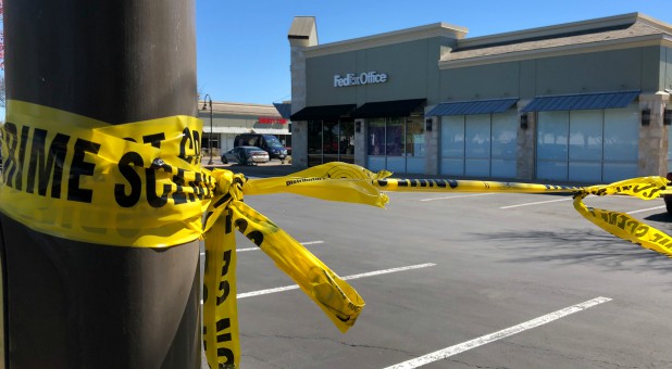 A police crime scene tape blocks off a FedEx store which is closed, with police saying it may be linked to the overnight bomb at Schertz, Texas FedEx facility, in Austin, Texas.