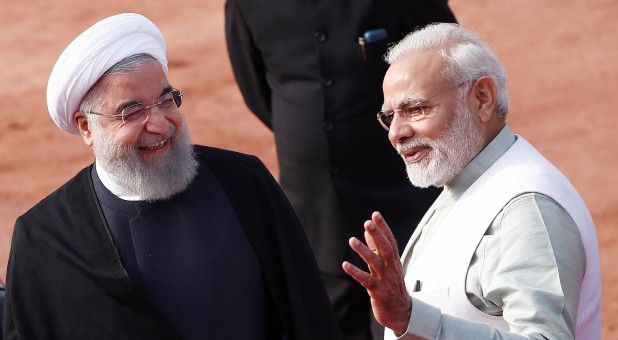 India's Prime Minister Narendra Modi (R) gestures as Iranian President Hassan Rouhani smiles during Rouhani's ceremonial reception in New Delhi, India.