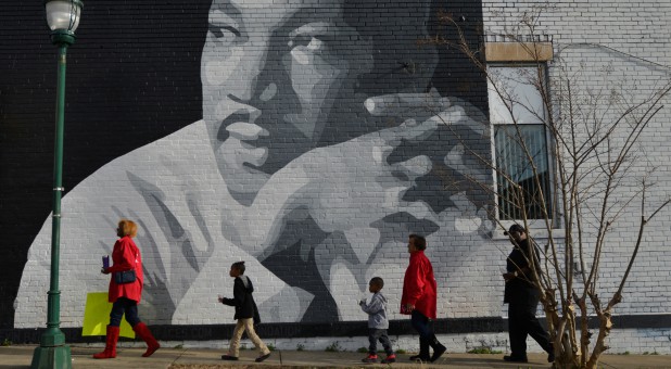 People gather to march in the annual parade down MLK Boulevard to honor Martin Luther King, in Chattanooga, Tennessee.