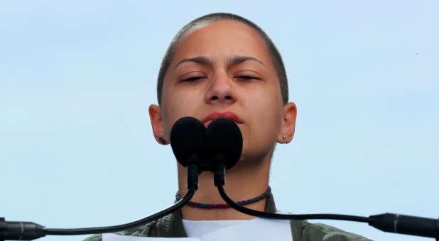 Emma Gonzalez, a student and shooting survivor from the Marjory Stoneman Douglas High School in Parkland, Florida, cries as she addresses the conclusion of the
