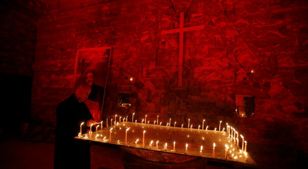 Chaldean Church of St. Paul is illuminated with red light in protest against the persecution of Christians around the world, particularly in Syria and Iraq, in Mosul, Iraq.