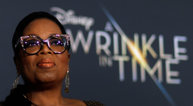 Cast member Oprah Winfrey poses at the premiere of