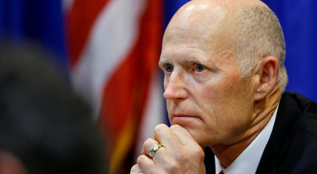 Florida Governor Rick Scott listens during a meeting with law enforcement, mental health and education officials about how to prevent future tragedies in the wake of last week's mass shooting at Marjory Stoneman Douglas High School.