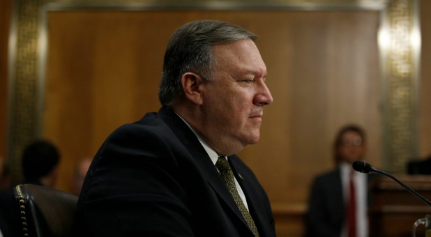 CIA Director Mike Pompeo responds to questions from Sen. Cory Booker as Pompeo testifies before a Senate Foreign Relations Committee confirmation hearing on Pompeo's nomination to be secretary of state.