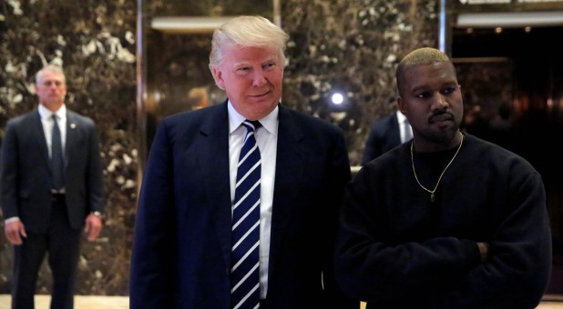 Then-U.S. President-elect Donald Trump and musician Kanye West pose for media at Trump Tower in 2016.