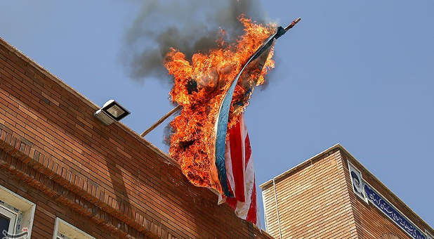 2018 05 American flag burns Iran