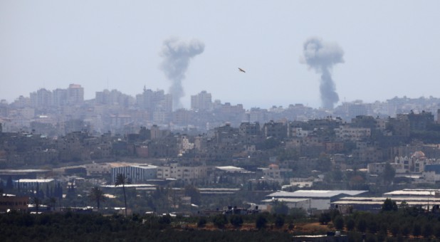 Smoke rises following an Israeli air strike in the Gaza Strip, as seen from the Israeli side of the border between Israel and Gaza.