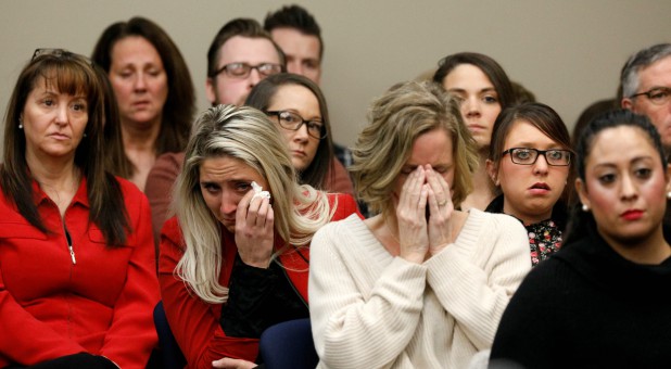 Victims and others look on as Rachael Denhollander speaks at the sentencing hearing for Larry Nassar, a former team USA Gymnastics doctor who pleaded guilty in November 2017 to sexual assault charges, in Lansing, Michigan.