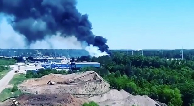 Smoke rises from the site where a Puerto Rico Air National Guard cargo plane crashed near Savannah, Georgia, the U.S., in this still image taken from a May 2, 2018, video obtained from social media.