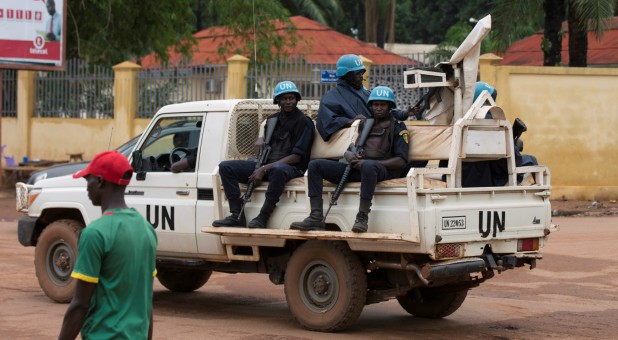 United Nations peacekeeping soldiers ride a pickup truck while on patrol in Bangui, Central African Republic.