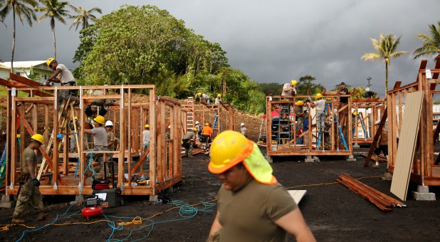 Soldiers of the Hawaii National Guard build temporary housing units for evacuees in Pahoa during ongoing eruptions of the Kilauea Volcano in Hawaii.