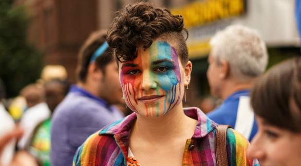 A person poses for photo at the Pride day parade in the Queens borough of New York City.