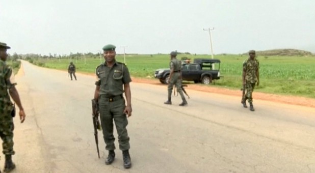 A still image taken from a video shot on June 25, 2018, shows security officers on the street in Plateau, Nigeria.