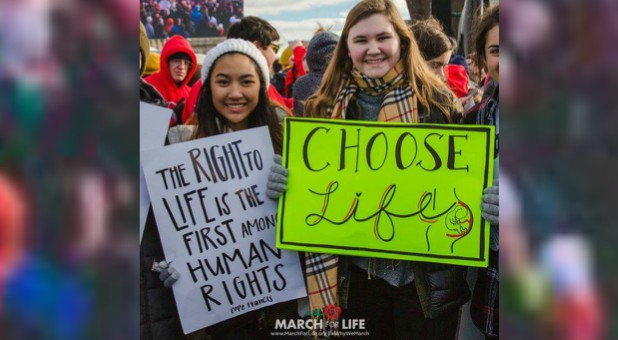 Two young women march for life.