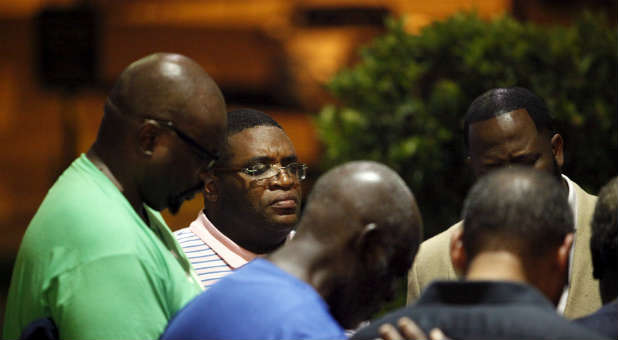 Members of Emanuel AME Church pray for one another.