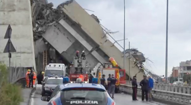 Rescue workers are seen at the collapsed Morandi Bridge in the Italian port city of Genoa, Italy.