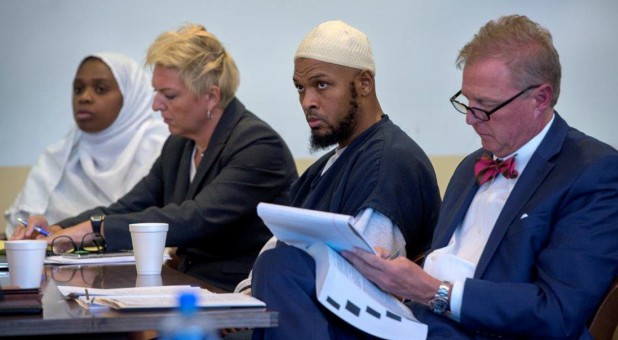 Defendant Jany Leveille (L to R) sits next to her defense lawyer Kelly Golightley, defendant Siraj Ibn Wahhaj and his defense lawyer Tom Clark at hearing in Taos County District Court in Taos County, New Mexico.