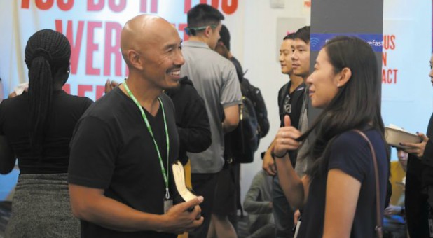 Francis Chan speaks with a woman.