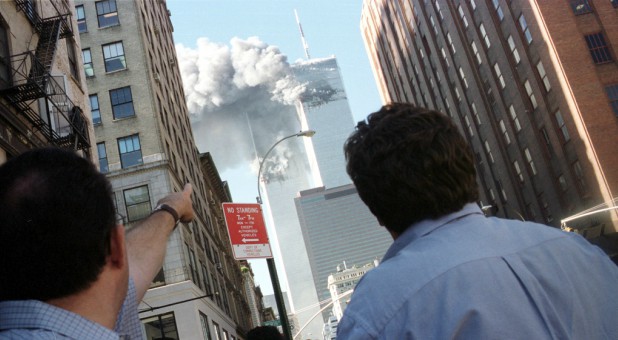 Pedestrians react to the World Trade Center collapse Sept. 11, 2001.