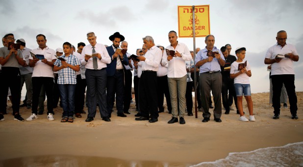 Jews take part in the Tashlich prayer, a Rosh Hashanah ritual, on the shores of the Mediterranean Sea.