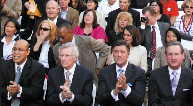 David Wilkerson, bottom center left, and Carter Conlon, bottom center right, at a Prayer in the Square event.
