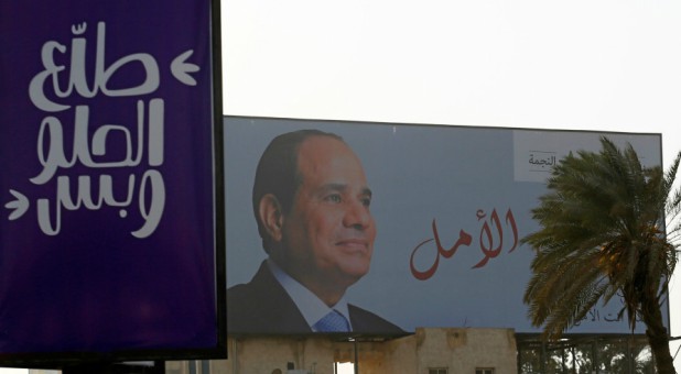 An election campaign billboard featuring Egyptian President Abdel Fattah el-Sisi.