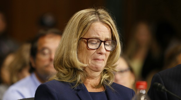 Christine Blasey Ford reacts as she speaks before the Senate Judiciary Committee hearing on the nomination of Brett Kavanaugh.