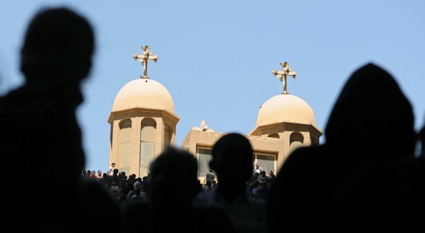 Coptic Orthodox Christians attend a Palm Sunday mass at the Samaan el-Kharaz Monastery in the Mokattam Mountain area of Cairo.
