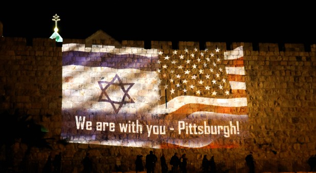 An image of Israeli and American flags with the wording,