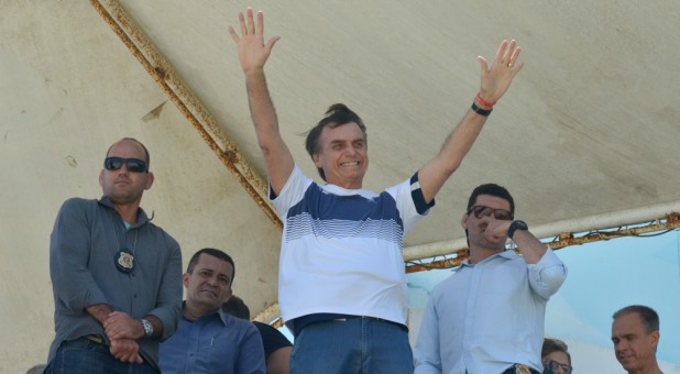 Brazil's new president-elect, Jair Bolsonaro, waves to supporters.
