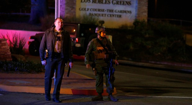 Police guard the site of a mass shooting at a bar in Thousand Oaks, California.