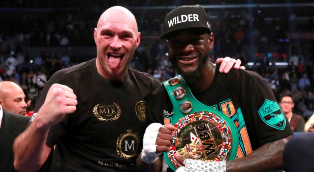 Tyson Fury, left, with Deontay Wilder