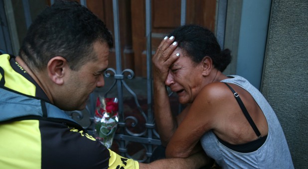People react after a shooting at Catholic cathedral in Campinas, Brazil, Dec.11, 2018.