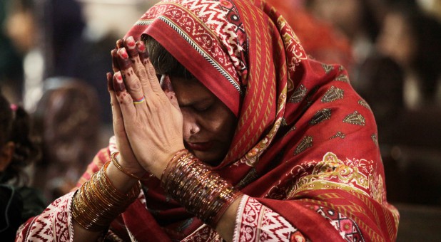 A Pakistani Christian woman prays during Mass.